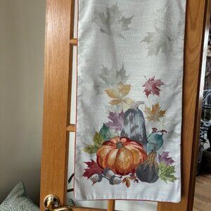 Haymarket Square table runner with pumpkins and fall design